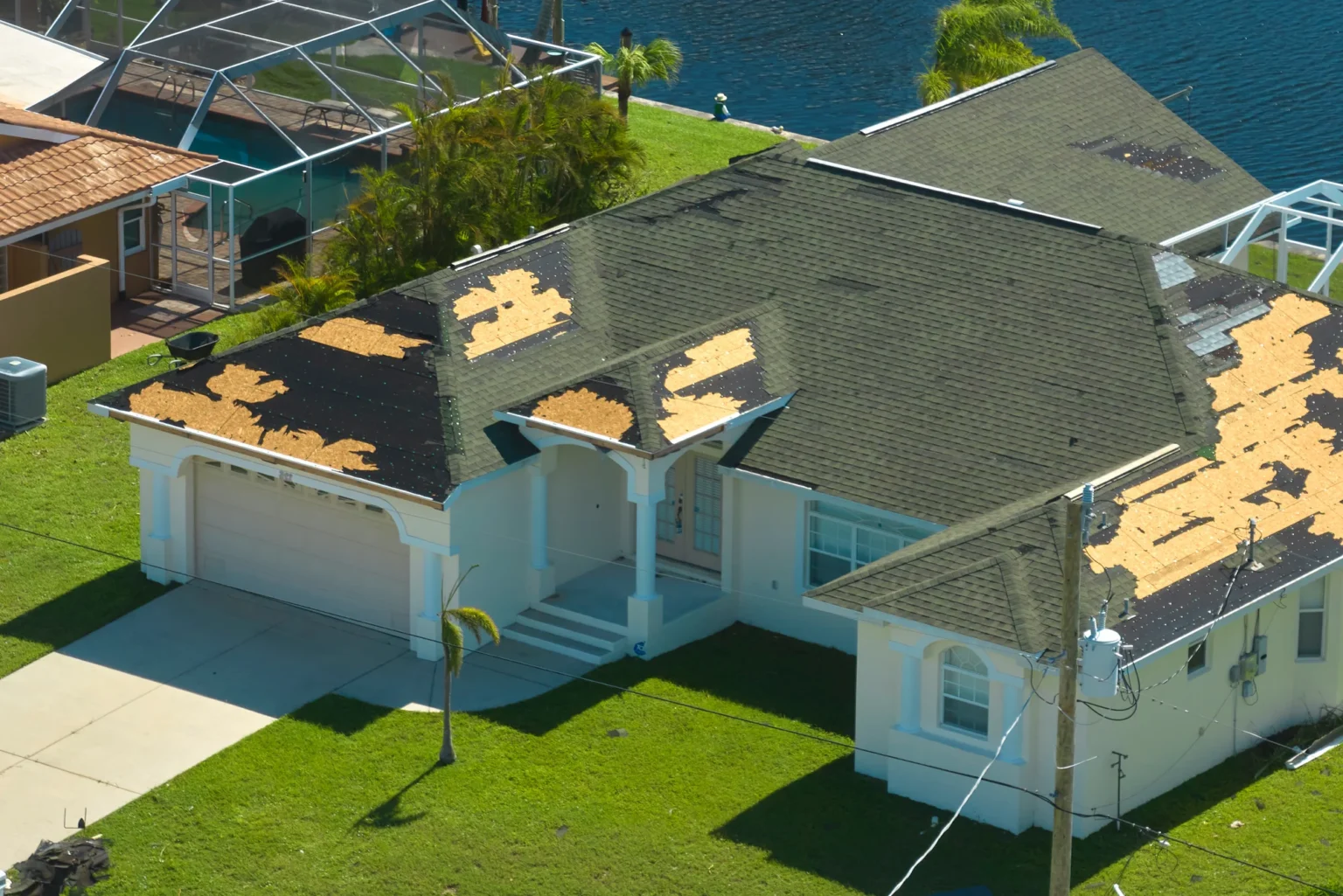 Roof with hurricane damage and missing shingles
