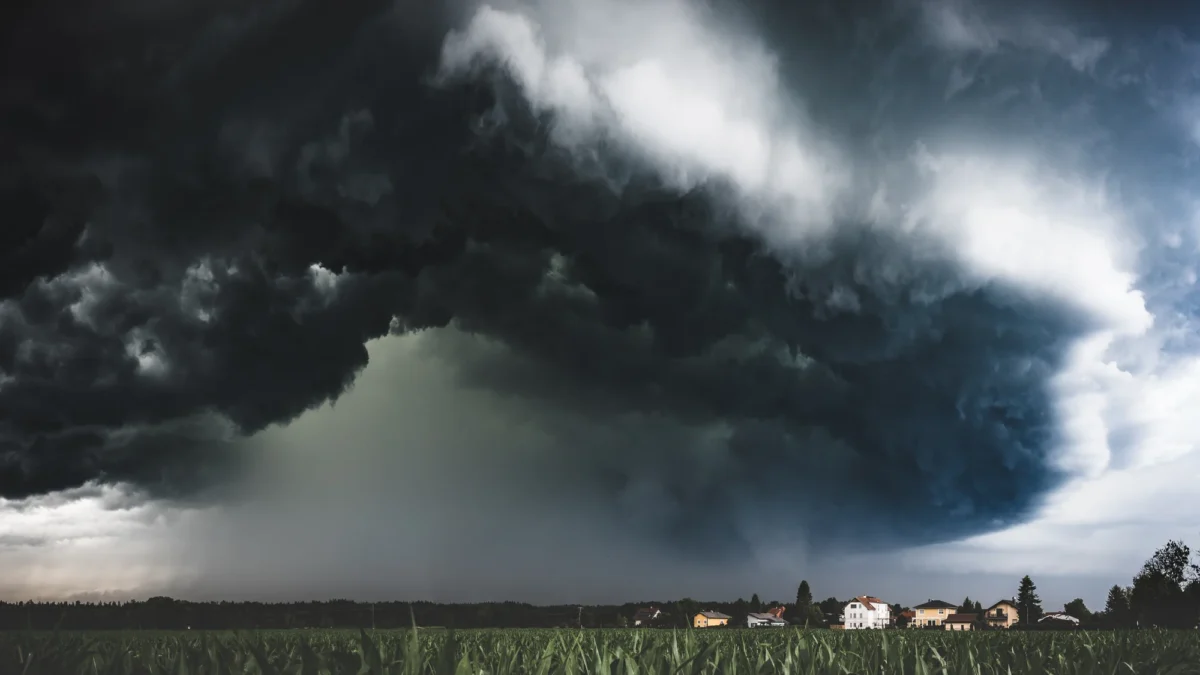Thunderstorm clouds rolling above houses